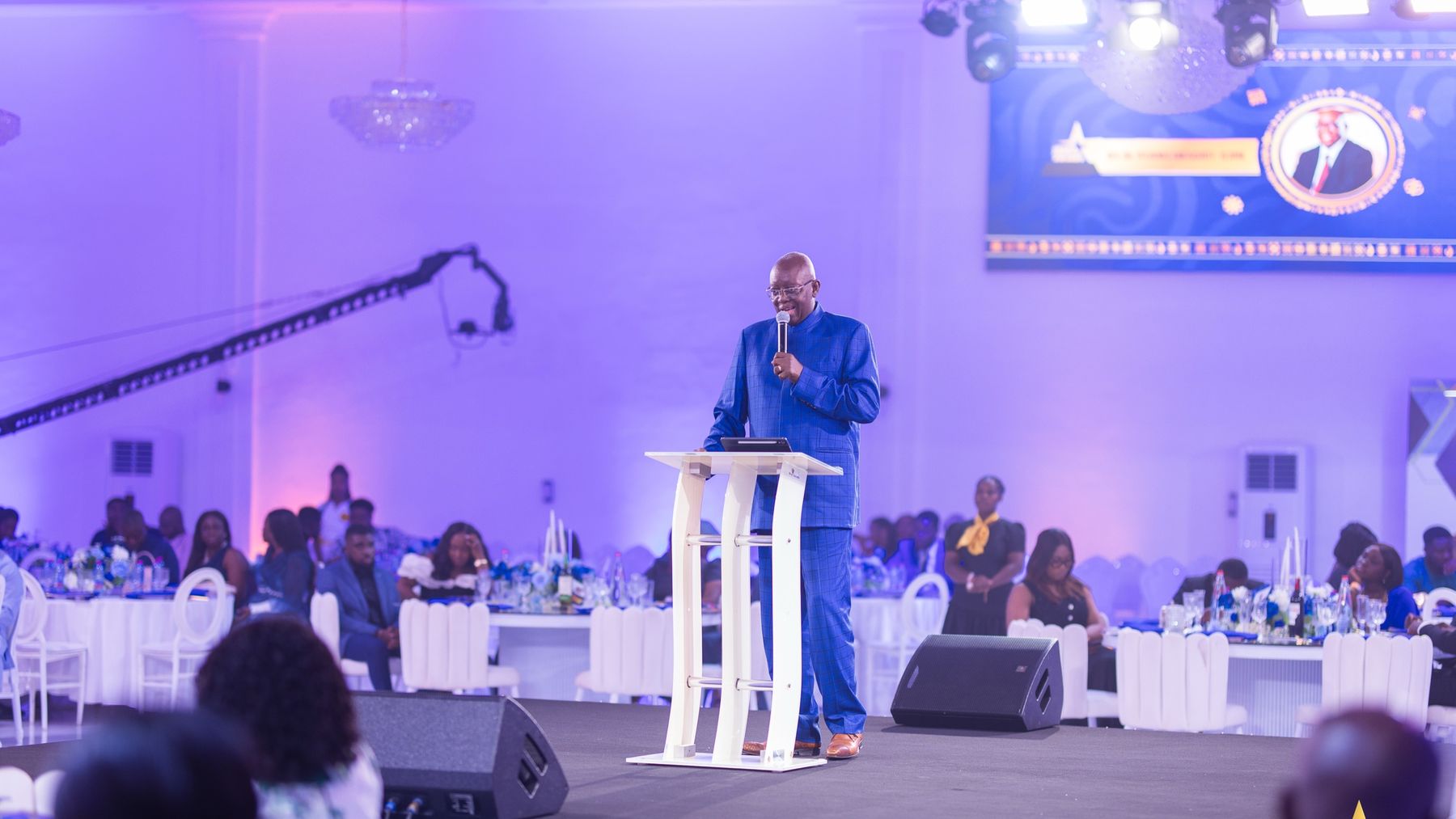 A speaker addresses guests from the stage at the Ghana Fintech Awards